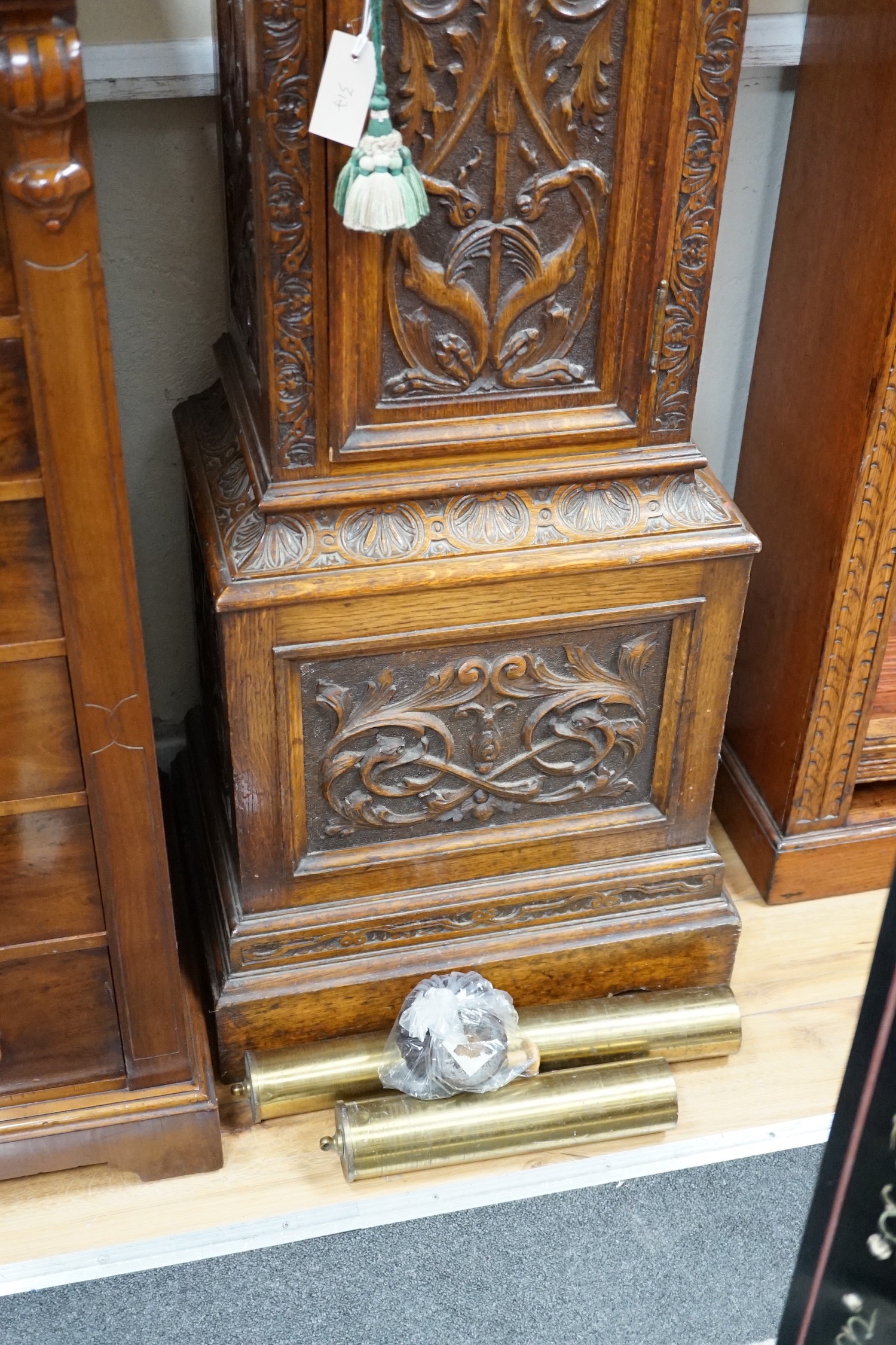 A late Victorian Camerer Cuss & Co carved oak chiming longcase clock, height 237cm *Please note the sale commences at 9am.